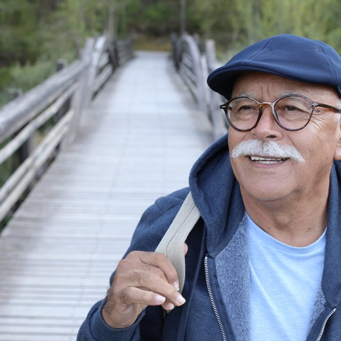 Senior man in rustic background