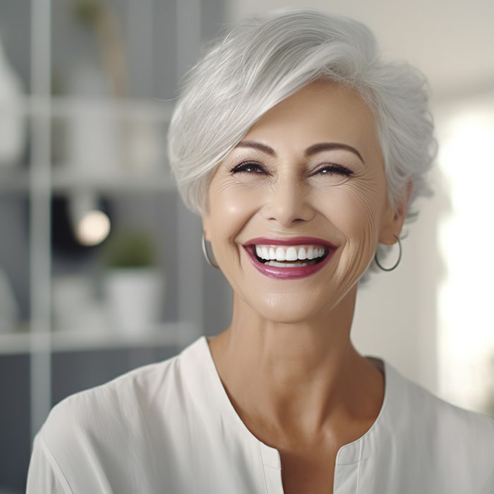 Dentist, veneers or dentures in senior woman mouth or teeth look